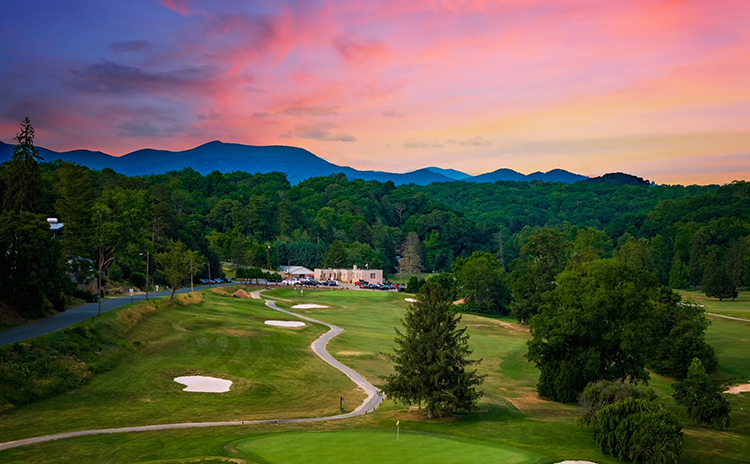 View of golf course fairway at sunset